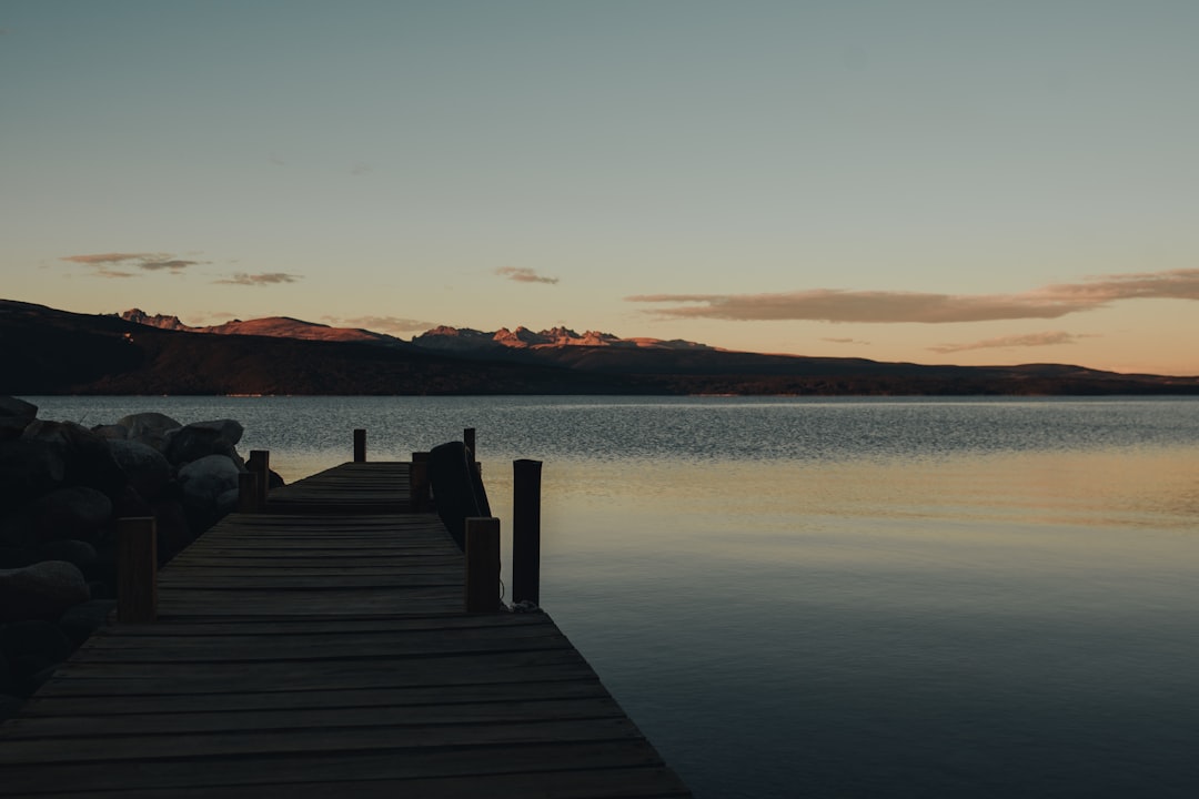 a wooden dock sitting next to a body of water